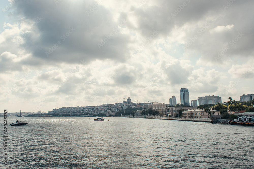 Ships in sea near seafront with cloudy sky at background, Istanbul, Turkey