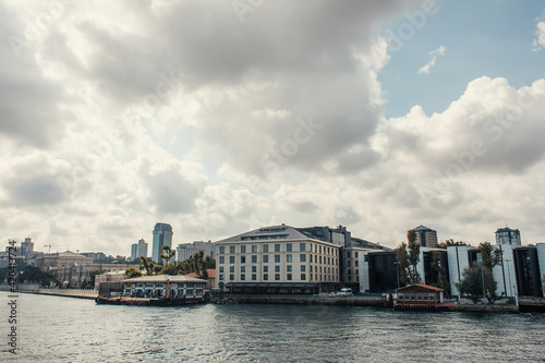 Buildings on seafront with cloudy sky at background in Istanbul, Turkey © LIGHTFIELD STUDIOS