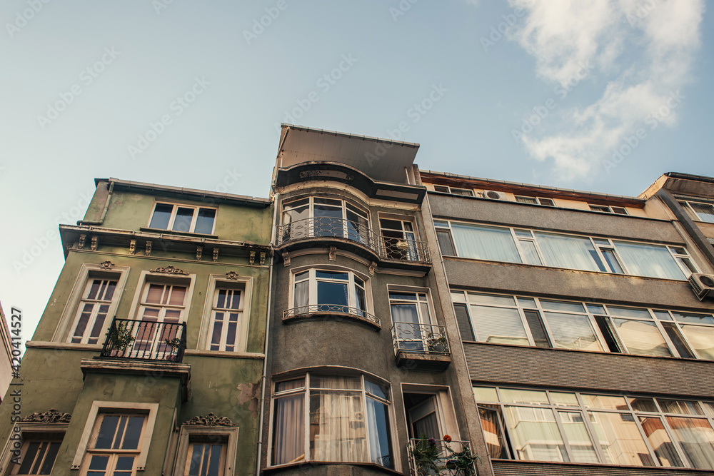 Low angle view of facade of old house with sky at background, Istanbul, Turkey
