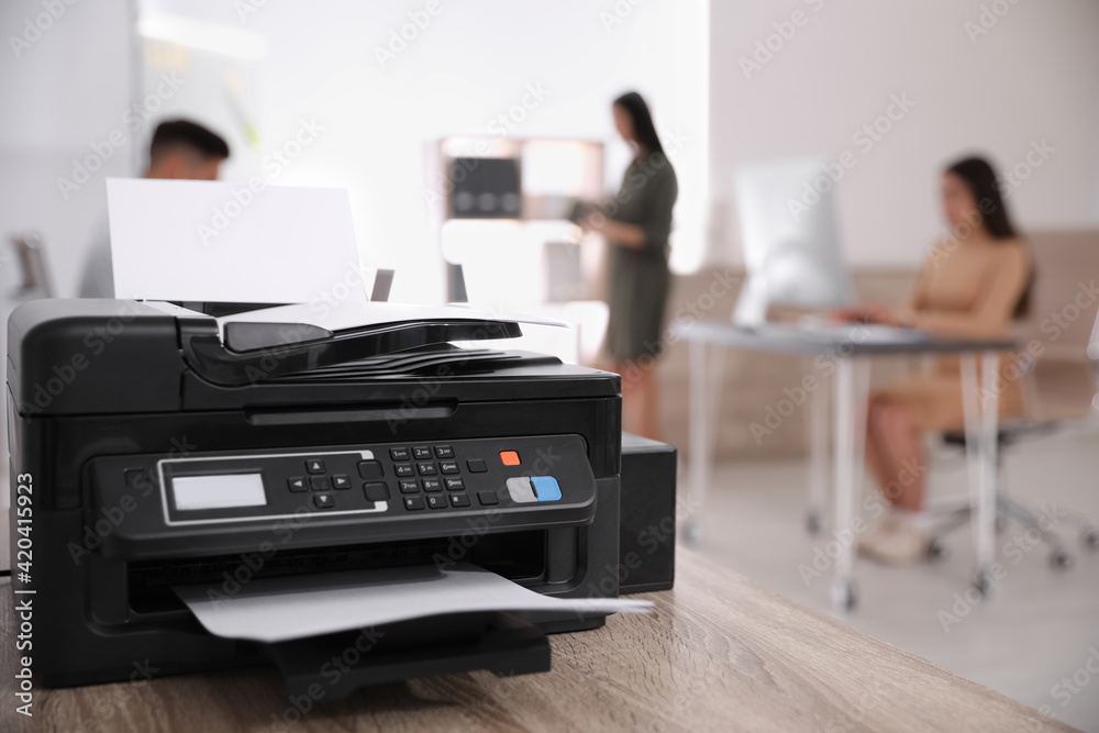 New modern printer on table in office. Space for text New modern printer on table in office. Space for text
