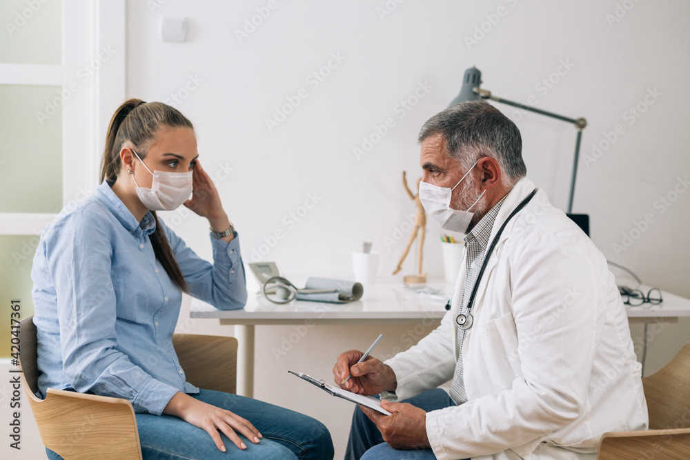 Fototapeta premium woman consults with doctor at hospital