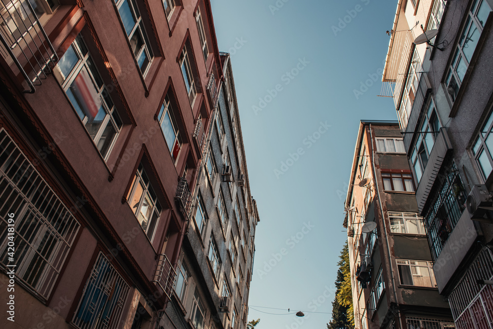 low angle view of contemporary buildings against blue sky low angle view of contemporary buildings against blue sky