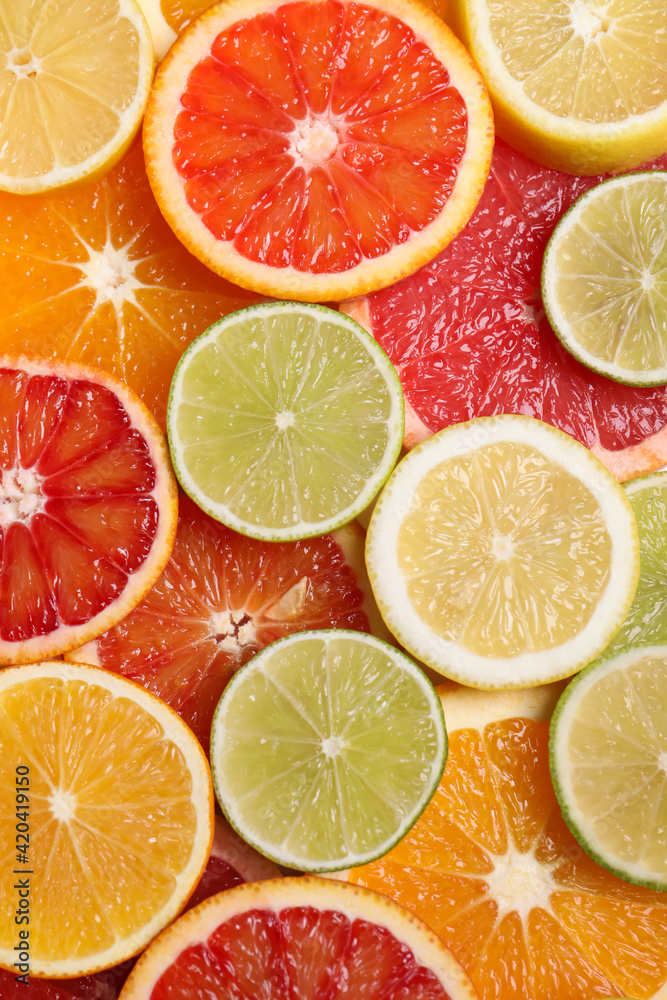Fototapeta premium Fresh juicy citrus fruits as background, top view