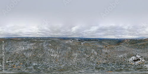 Eastern Sayans. Spherical panorama of the Krasnoyarsk Pillars National Park. Siberian taiga in winter. Aerial view.
