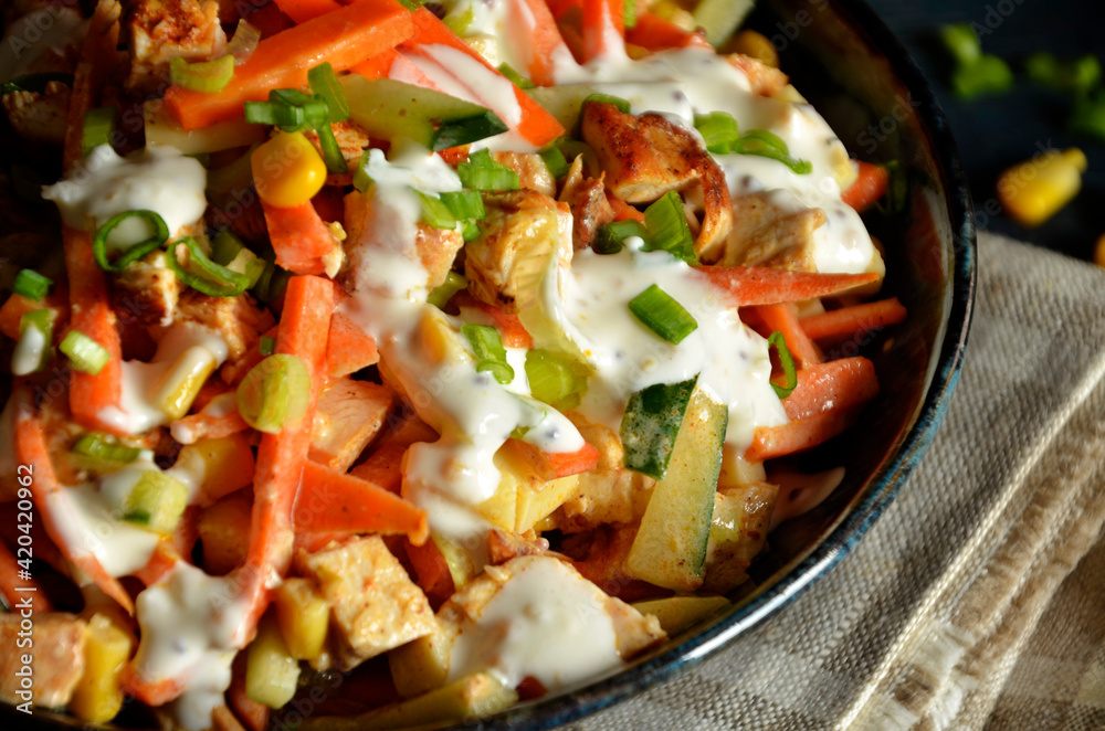 Fresh chicken salad with vegetables topped with dressing Fresh chicken salad with vegetables topped with dressing