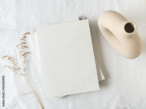 Empty blank white magazine cover mock up, vase and dried grass photo