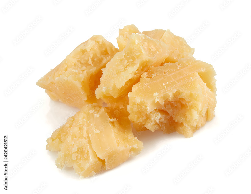 broken pieces of hard cheese isolated on white background
