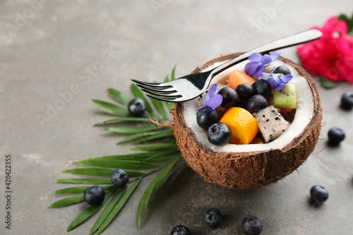 Fototapeta Naklejka Na Ścianę i Meble -  Delicious exotic fruit salad served on grey table