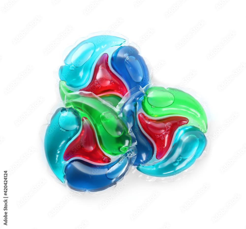 Fototapeta premium Laundry capsules on white background, top view