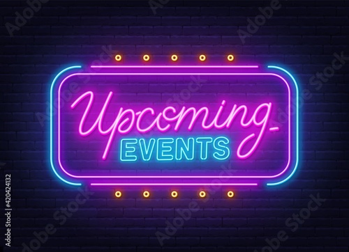 Upcoming Events neon sign on brick wall background.