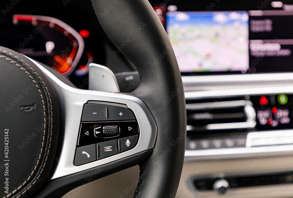 Buttons on steering wheel in a new modern car Buttons on steering wheel in a new modern car