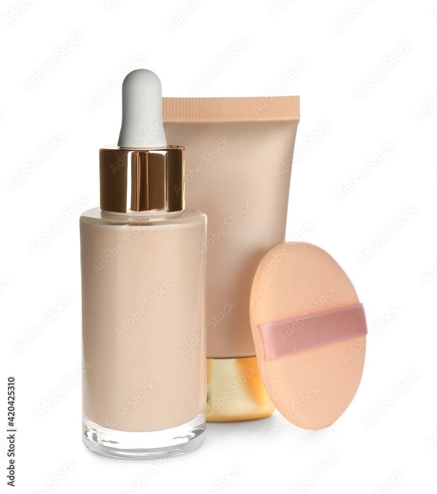Sponge, bottle and tube with skin foundation on white background. Makeup products Sponge, bottle and tube with skin foundation on white background. Makeup products
