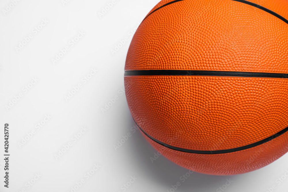 Fototapeta premium Orange ball on white background, top view. Basketball equipment