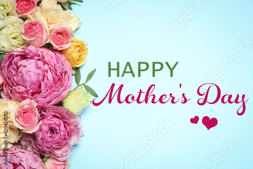 Happy Mother's Day. Happy Mother's Day. Beautiful flowers on light blue background, flat lay