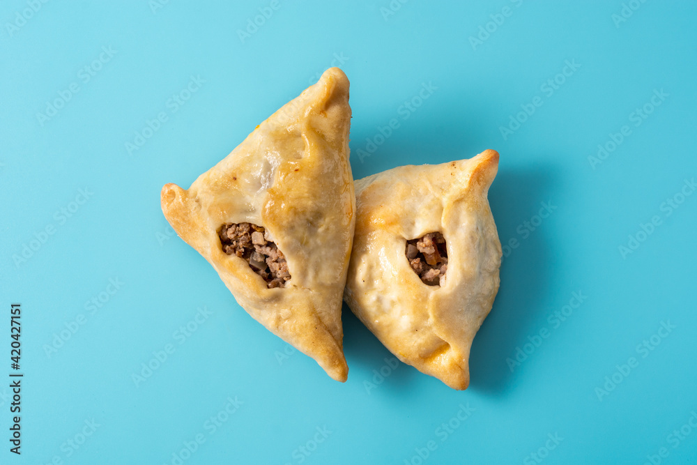 Traditional middle eastern fatayer on blue background