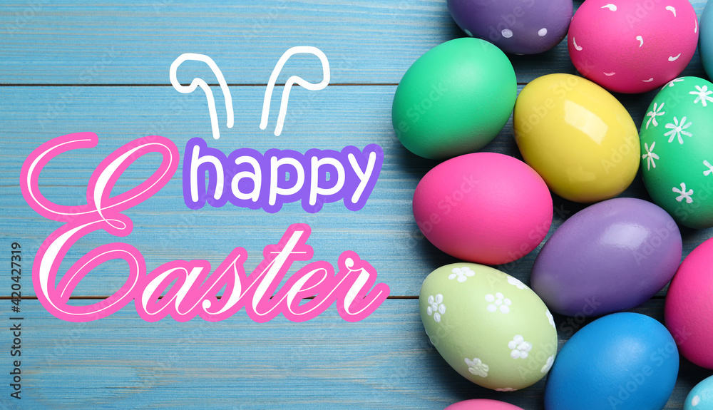 Happy Easter. Colorful eggs on blue wooden background, flat lay Happy Easter. Colorful eggs on blue wooden background, flat lay