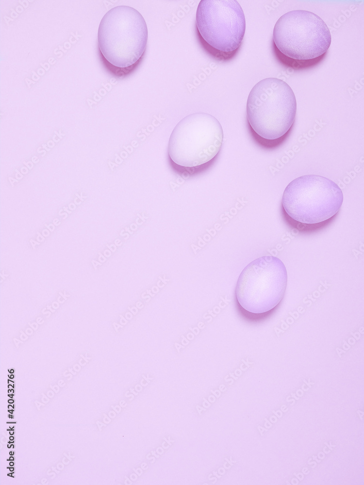 Creatively painted eggs in pastel colors on purple background. Copy space. Happy Easter concept. Flat lay. Creatively painted eggs in pastel colors on purple background. Copy space. Happy Easter concept. Flat lay.