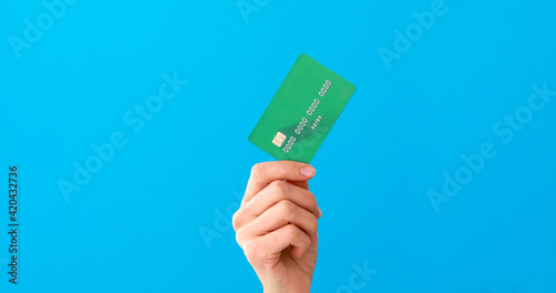 Hand holding credit cards and showing it