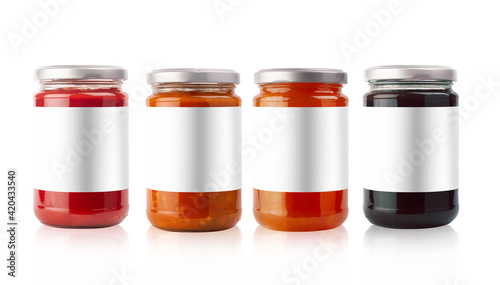 small jam and vegetables jars with blank labels