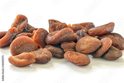 Dried apricots close up. Dried fruit isolated on white background.
