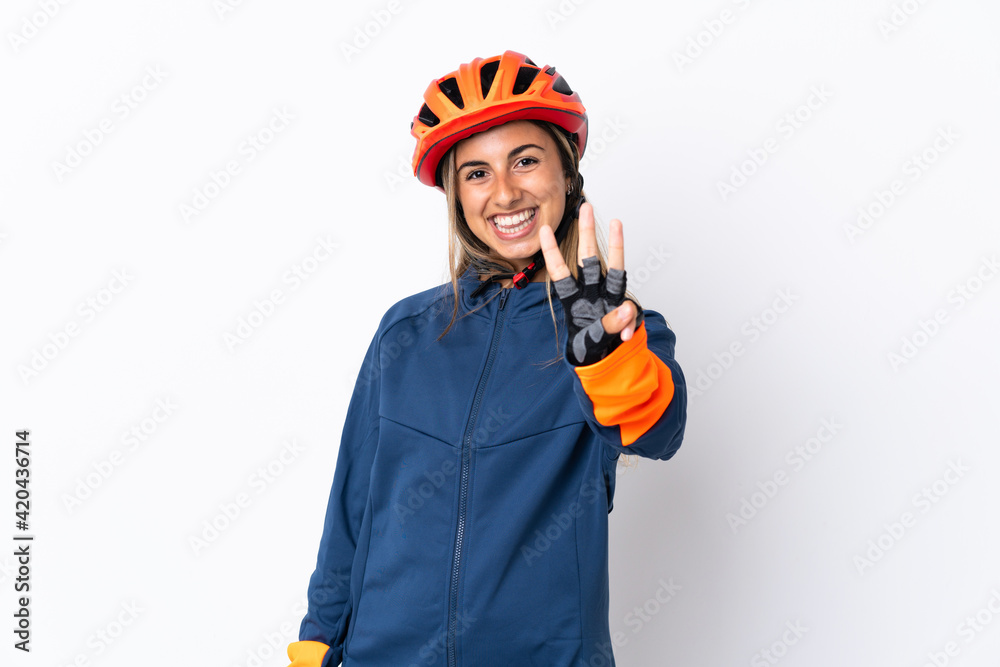 Young hispanic cyclist woman isolated on white background happy and counting three with fingers Young hispanic cyclist woman isolated on white background happy and counting three with fingers