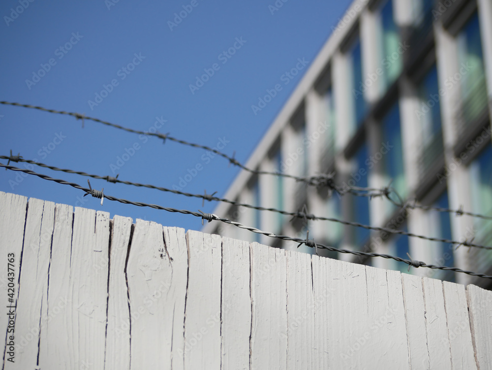 Construction fence in front of a building Construction fence in front of a building
