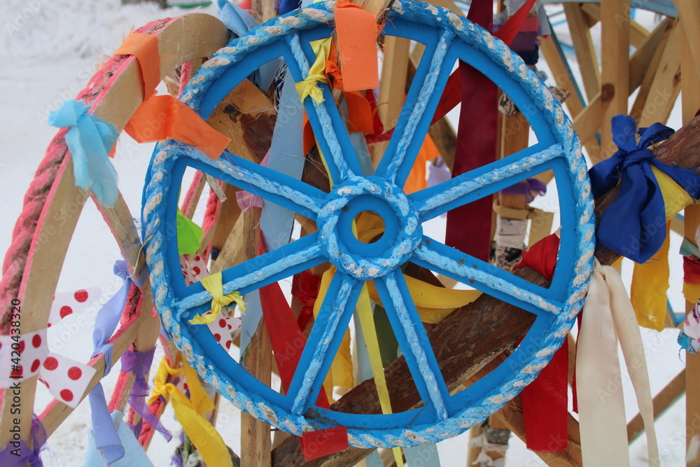 wooden multi-colored wheels with ribbons