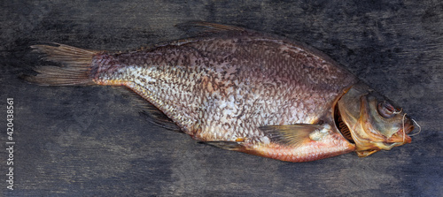 Salted and dried bream on a black surface