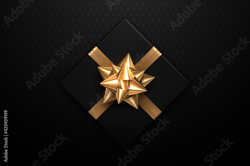 Black gift with gold bow