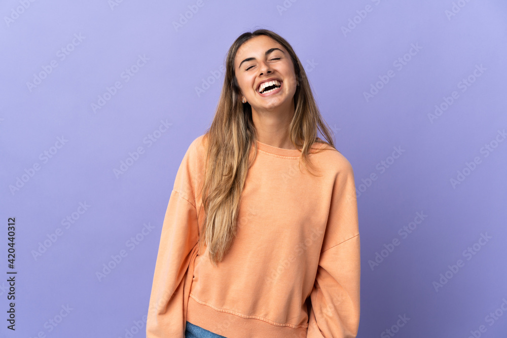 Young hispanic woman over isolated purple background laughing Young hispanic woman over isolated purple background laughing