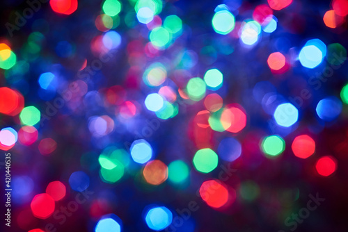 Blurred background, multicolored Christmas, New Year garland out of focus.