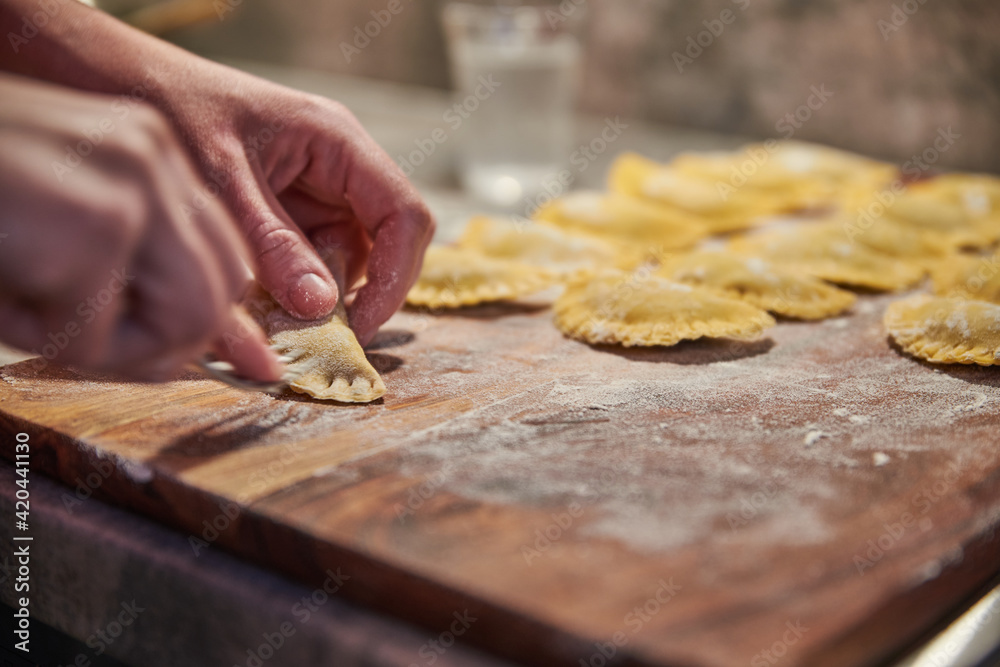 Preparing traditional italian ravioli. Homemade italian pasta. Preparing traditional italian ravioli. Homemade italian pasta.