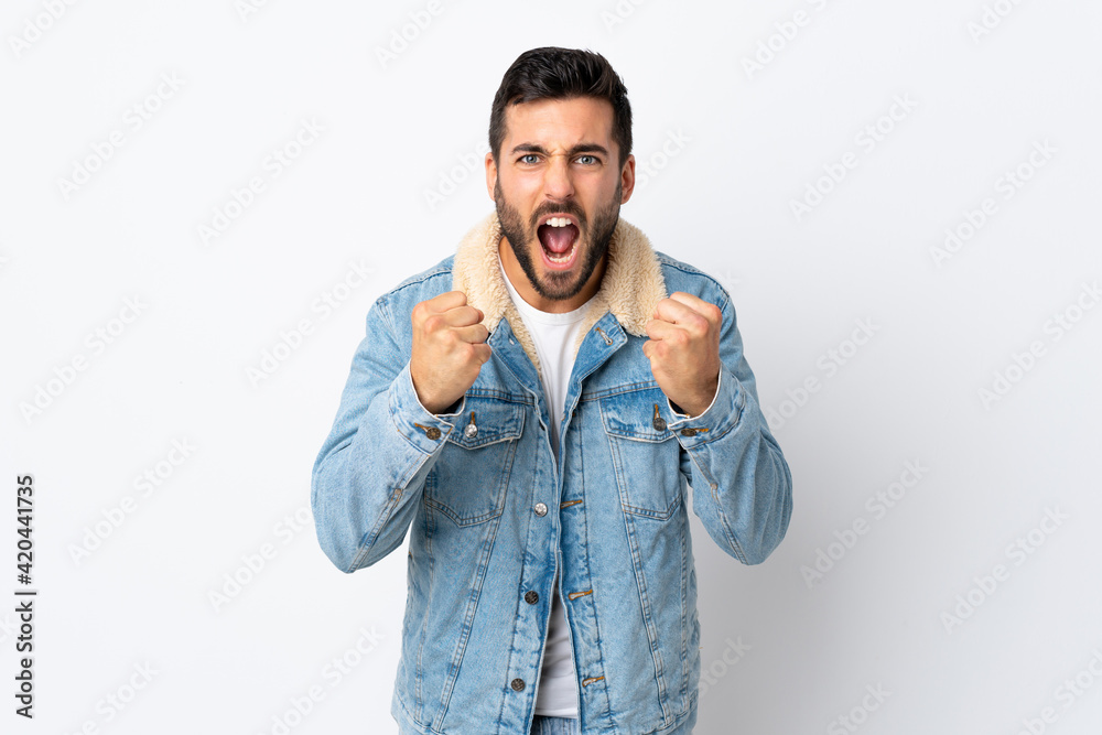 Fototapeta premium Young handsome man with beard isolated on white background frustrated by a bad situation