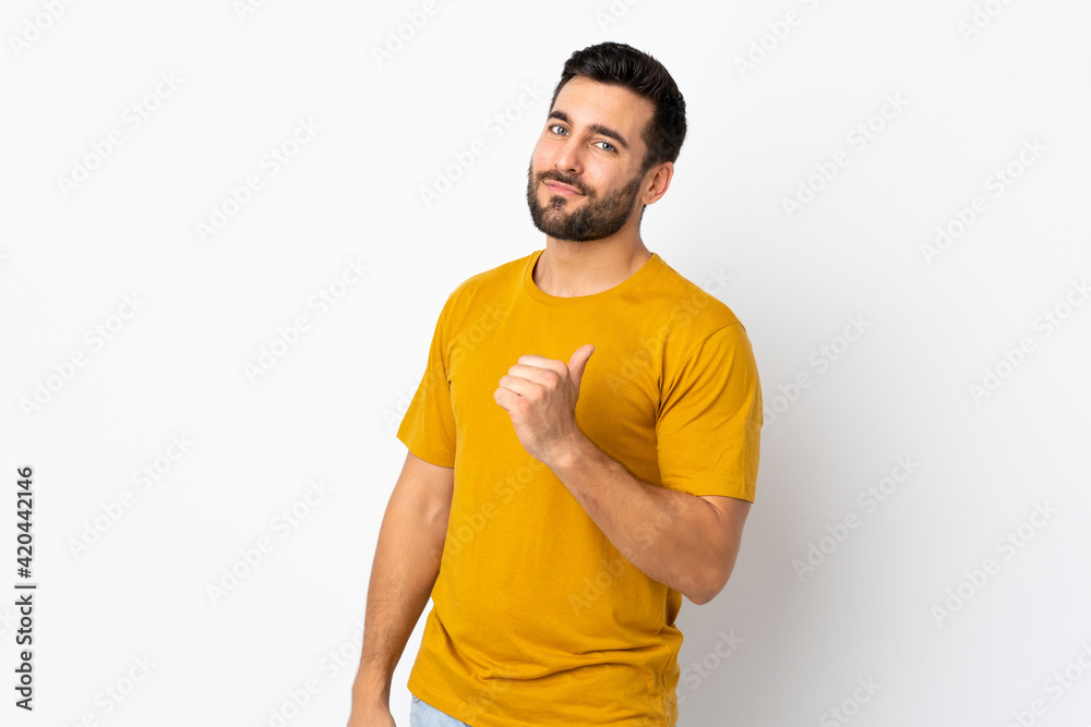 Young handsome man with beard isolated on white background proud and self-satisfied Young handsome man with beard isolated on white background proud and self-satisfied