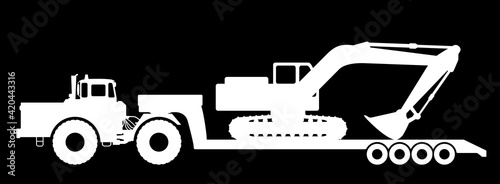 Silhouette of an excavator on a tractor trawl.