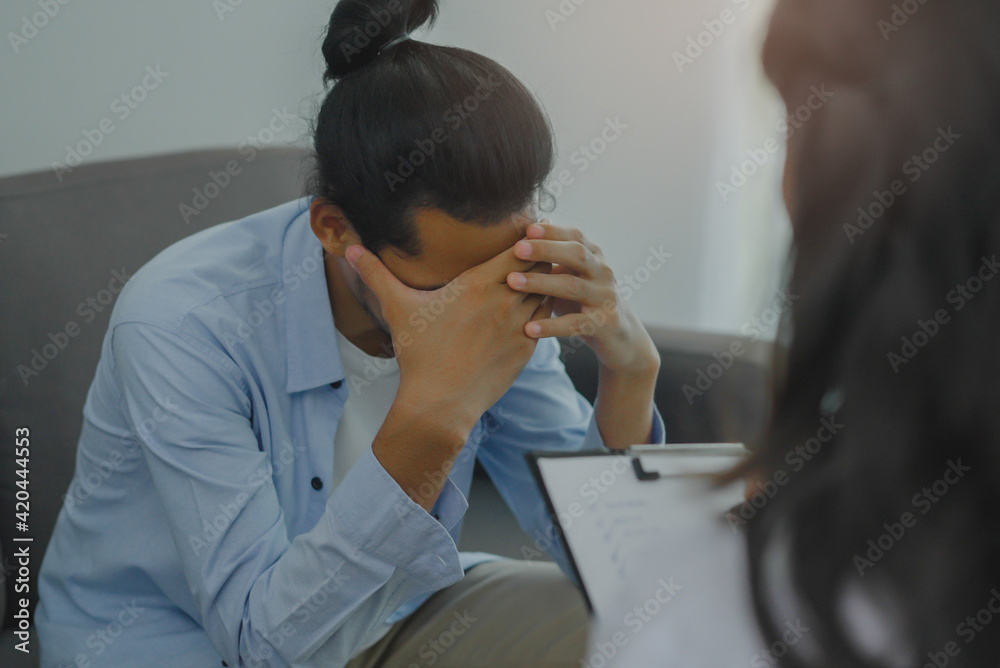 Men talk with a psychologist during talking therapy stressed mental health at office Men talk with a psychologist during talking therapy stressed mental health at office