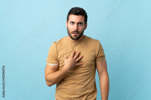 Young handsome man with beard over isolated background pointing to oneself