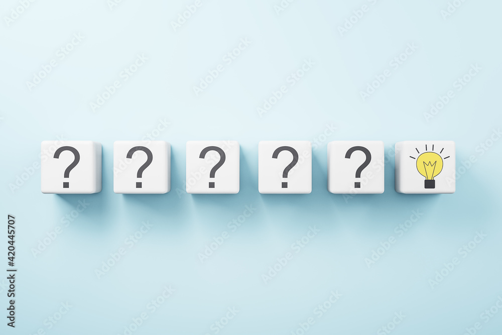 Idea concept with row of white cubes with question mark and one with yellow light bulb on blue background Idea concept with row of white cubes with question mark and one with yellow light bulb on blue background