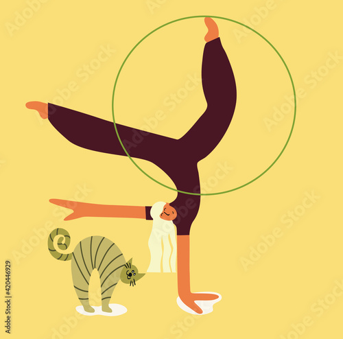 the girl is engaged with a hoop and a cat