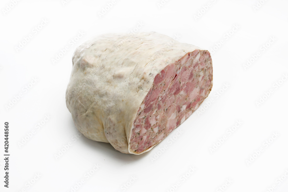 Pork headcheese in a natural casing isolated on a white background. Homemade brawn, cut, with visible cross section. Traditional meat product, a packshot photo for package design, template.