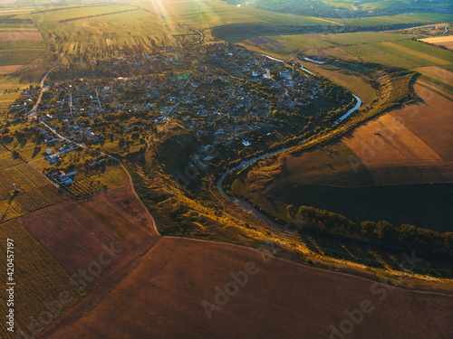 village at curve of river