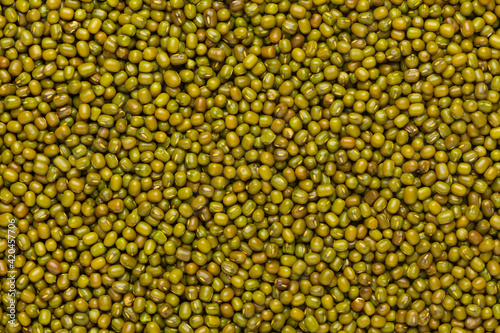 Close up of Organic green Gram (Vigna radiata) or whole green moong dal Full-Frame Background. Top View