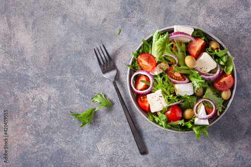 tomato salad with brie cheese olives onion lettuce