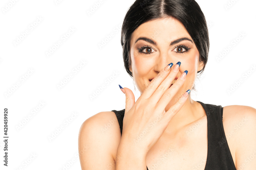 happy young woman cover her mouth with her hand happy young woman cover her mouth with her hand