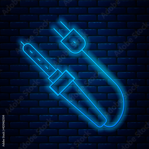 Glowing neon line Soldering iron icon isolated on brick wall background. Vector