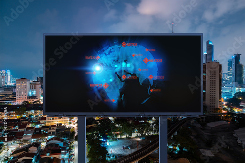 Hologram of Earth planet map on billboard over night panoramic cityscape of Kuala Lumpur  Malaysia  Asia. The concept of international companies in KL. Globe