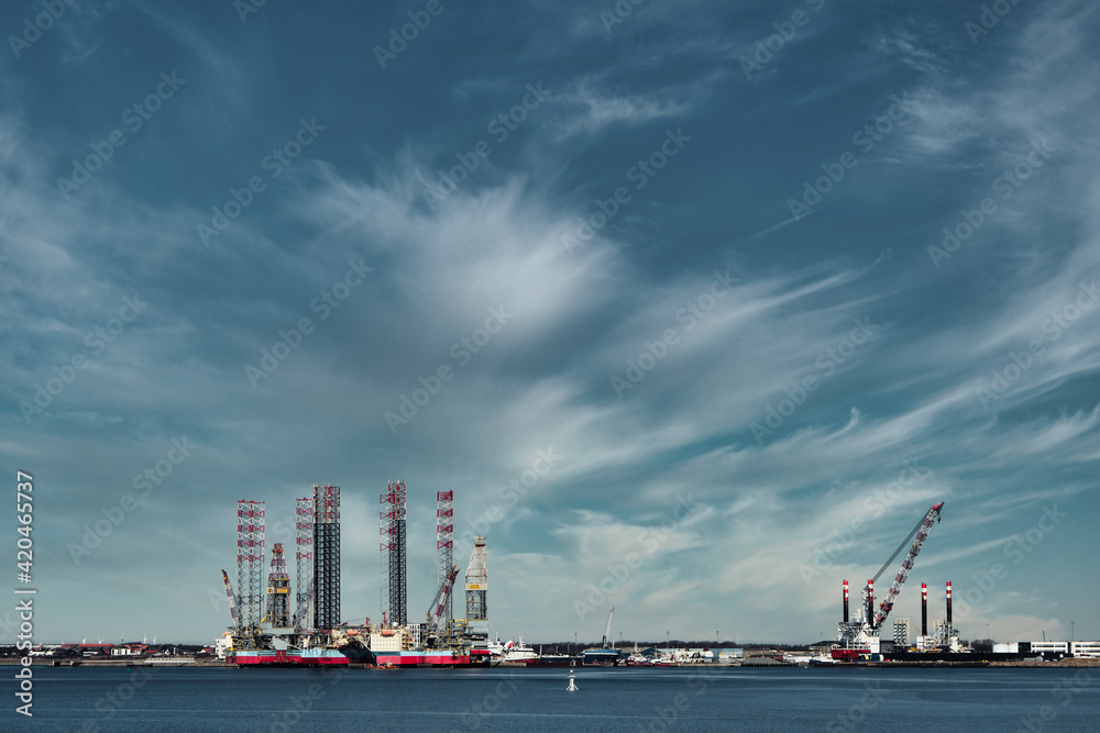 Oil and Wind power rigs in Esbjerg harbor. Denmark