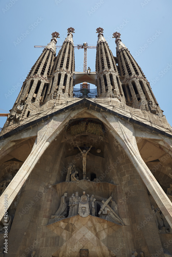 Sagrada Familia in 2009. Barcelona. Spain. Construction cranes on the horizon. Modern side.