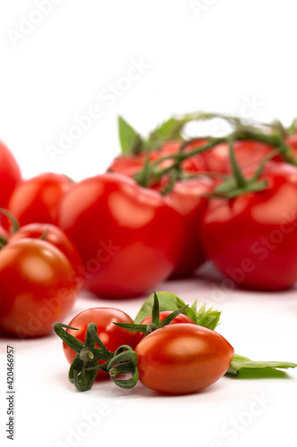 Tomatoes and cherry tomatoes in studio