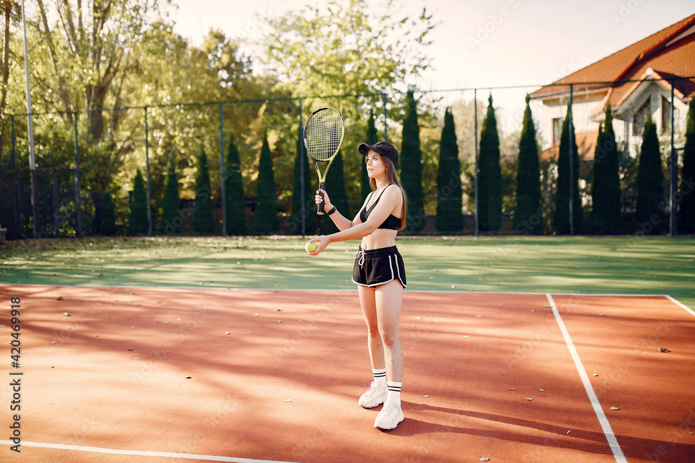 Beautiful and stylish girl on the tennis court